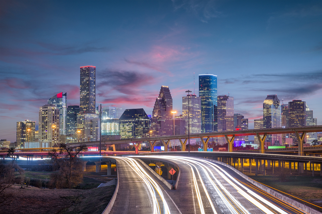 Houston, Texas, USA downtown city skyline and highway.